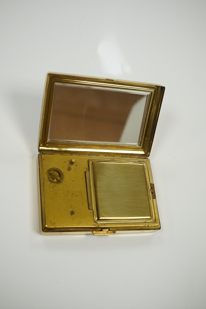 A Japanese damascened iron and gilt metal musical compact, 9cm wide. Condition - fair